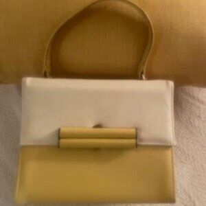 L.S. Ayres Gently used yellow and white handbag with magnetic closure.
